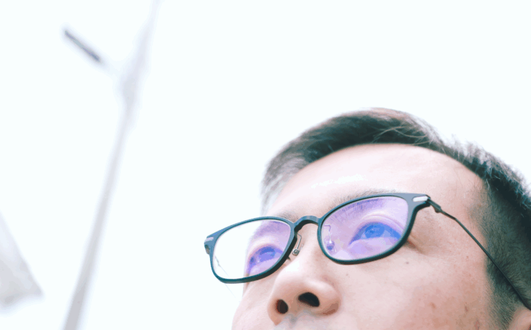 Man wearing blue light glasses